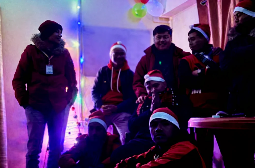 SantaCruz colleagues celebrating Christmas together in Santa hats